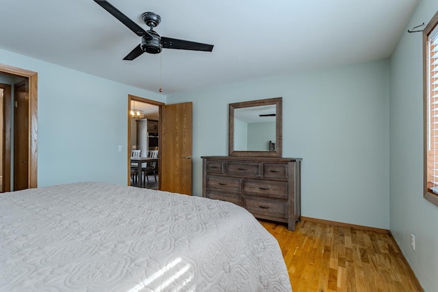 bedroom featuring ceiling fan and light wood-type flooring