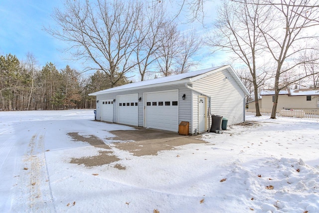 view of snow covered garage