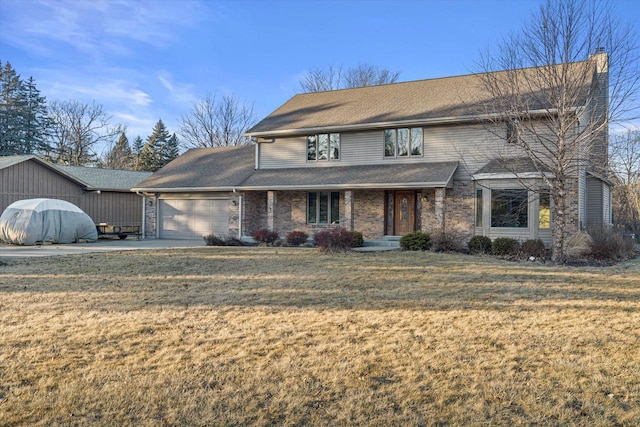 view of property with a garage and a front yard