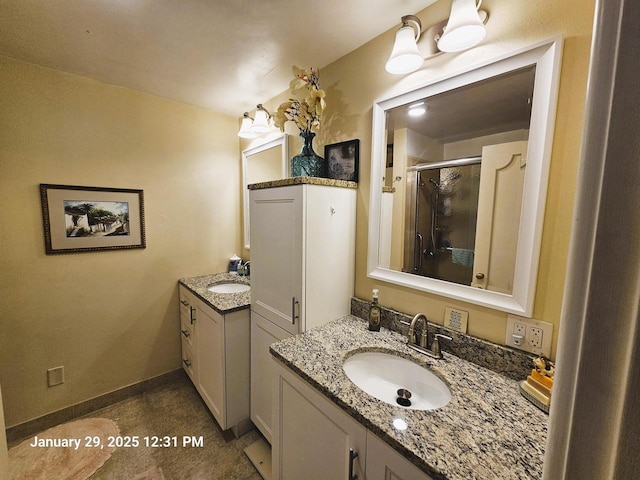 bathroom featuring vanity and a shower with shower door