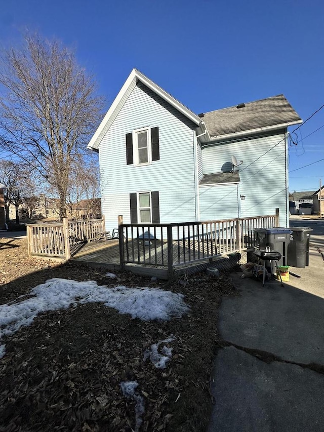 back of house featuring a deck