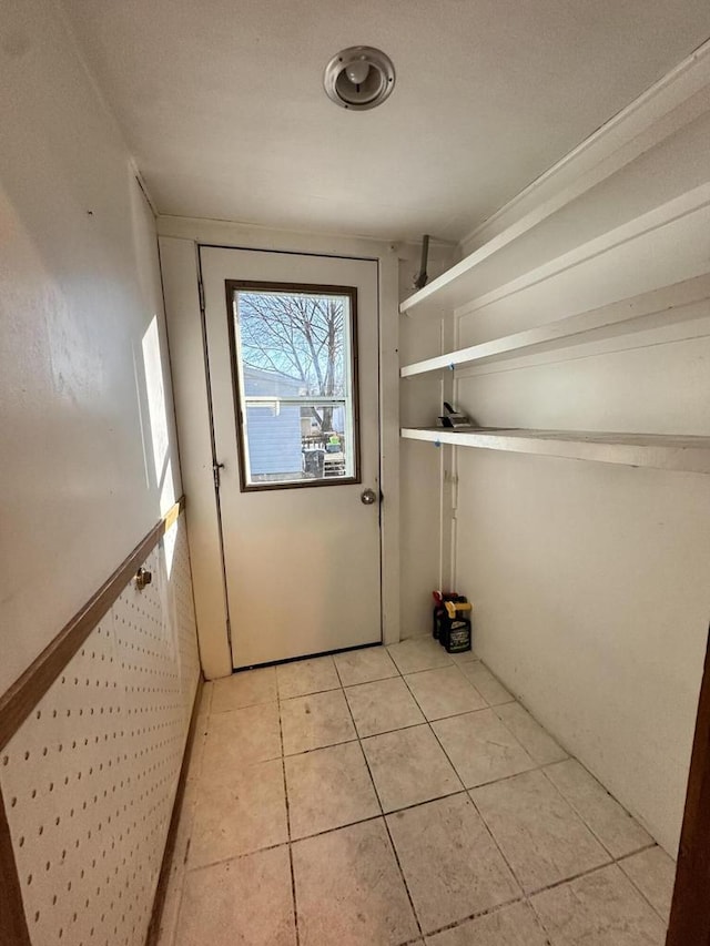 doorway featuring light tile patterned floors