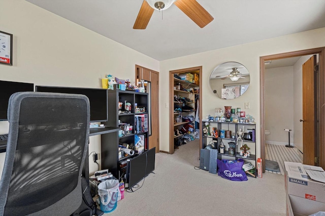 office with ceiling fan and light colored carpet