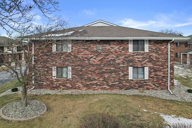 view of home's exterior featuring a lawn