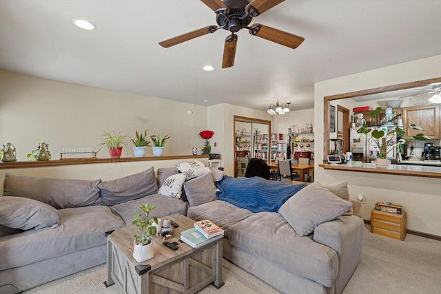 living room featuring light carpet and ceiling fan