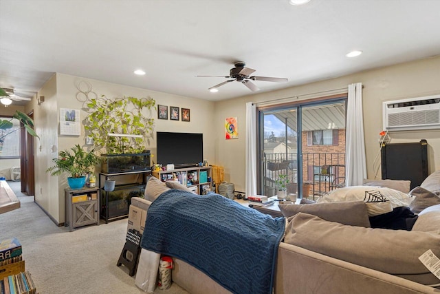 living room with light carpet, an AC wall unit, and ceiling fan