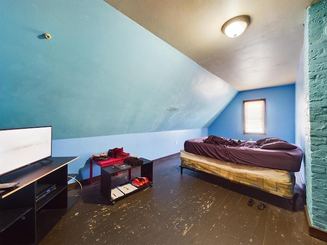 bedroom featuring lofted ceiling