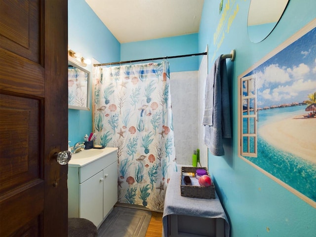 bathroom with vanity and hardwood / wood-style floors