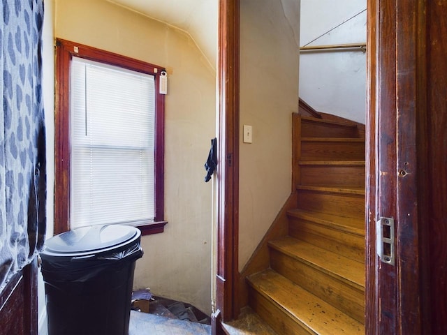 stairs with lofted ceiling