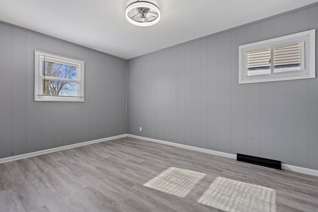 unfurnished room featuring light hardwood / wood-style floors