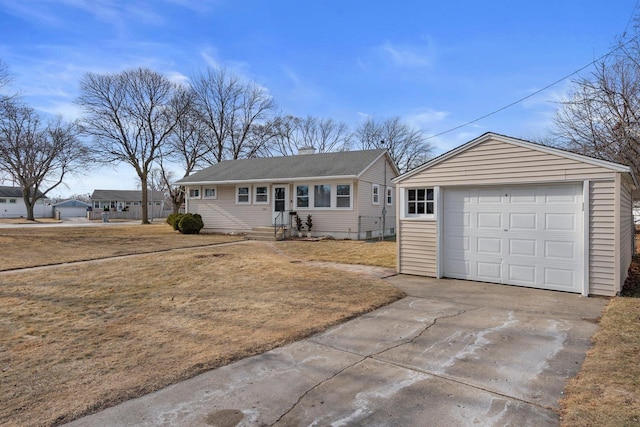 ranch-style home with an outbuilding and a garage