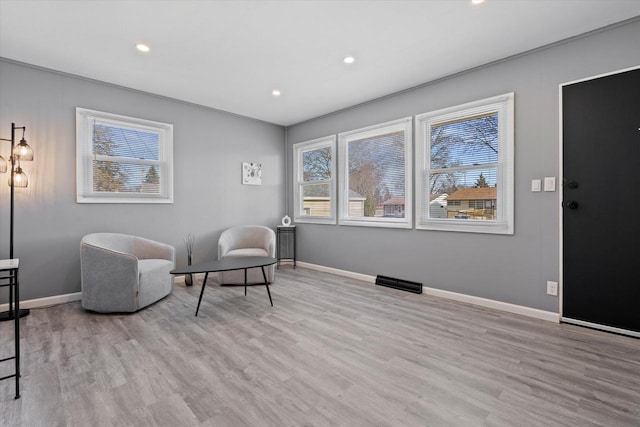 living area with light hardwood / wood-style floors