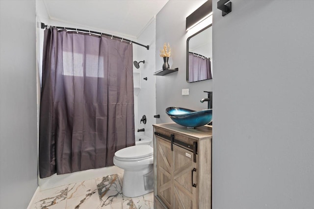 full bathroom with vanity, shower / tub combo, and toilet