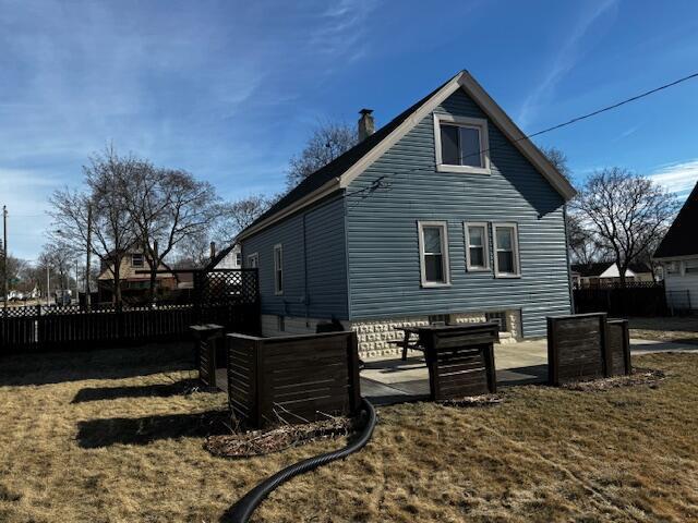 view of home's exterior featuring a yard and a patio