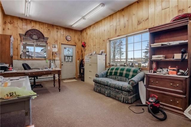 carpeted home office with a baseboard heating unit