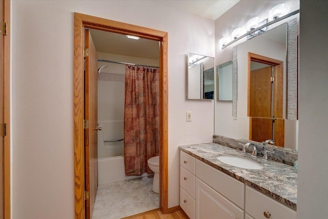 full bathroom featuring vanity, hardwood / wood-style flooring, toilet, and shower / bath combo with shower curtain