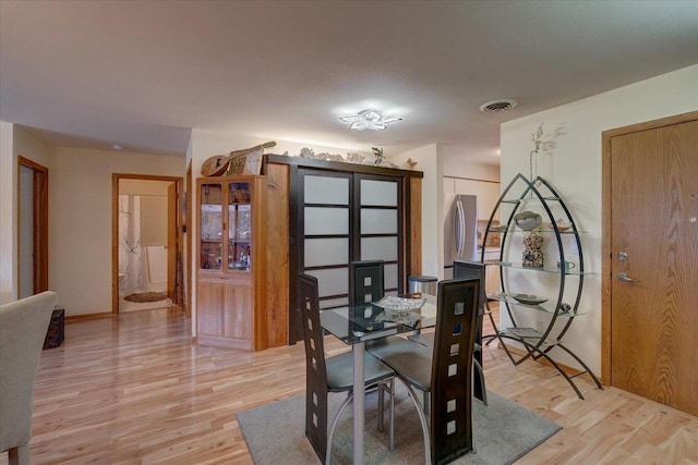 dining room featuring light wood-type flooring