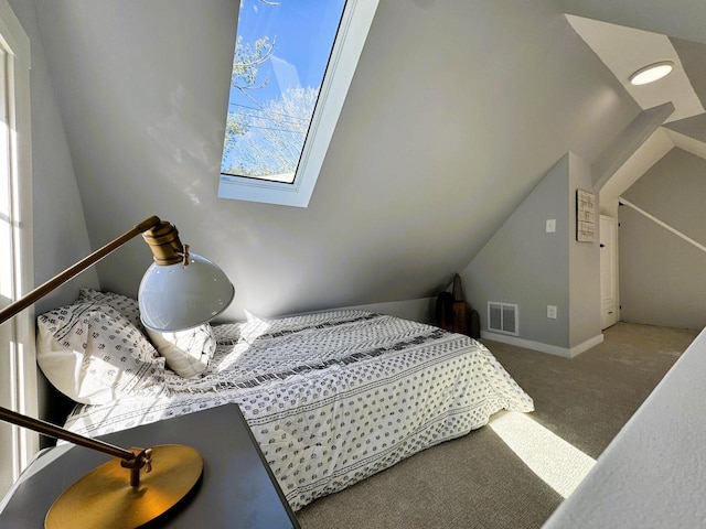 carpeted bedroom featuring lofted ceiling