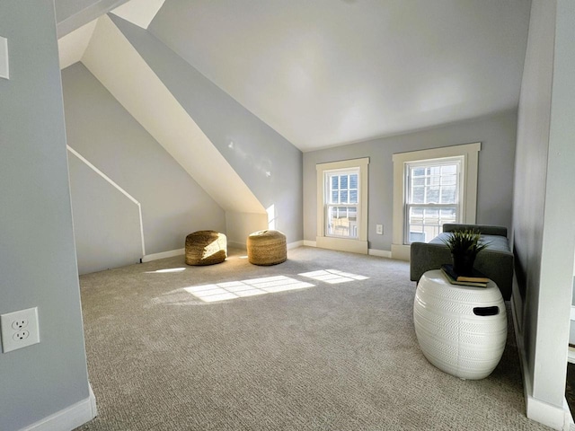 bonus room featuring light carpet and vaulted ceiling