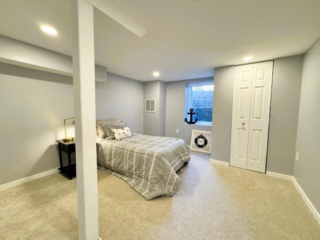 bedroom featuring light colored carpet