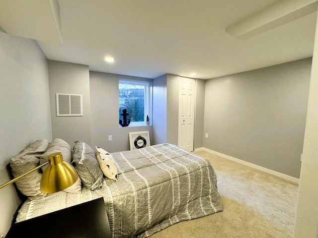 carpeted bedroom with a closet