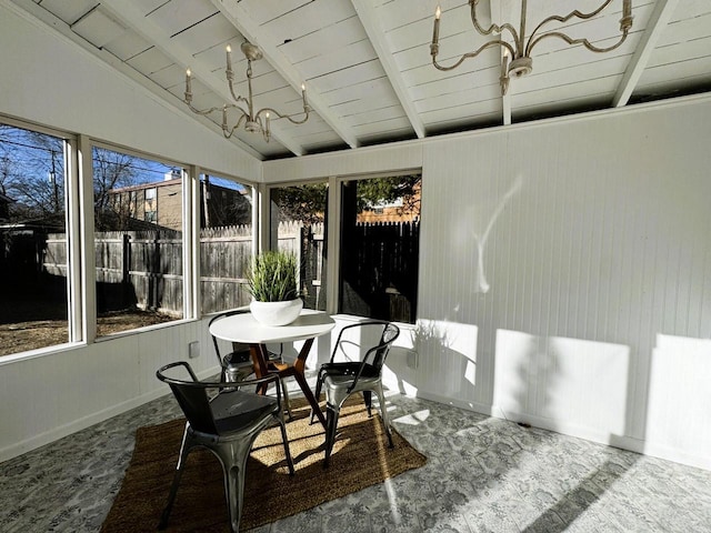 sunroom / solarium featuring vaulted ceiling with beams, wood ceiling, and a wealth of natural light