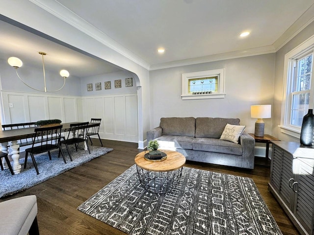 living room with crown molding and dark hardwood / wood-style floors