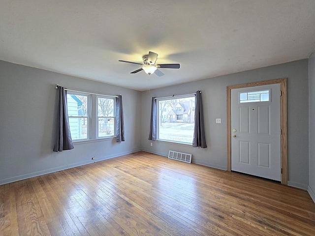 entrance foyer with hardwood / wood-style flooring and ceiling fan