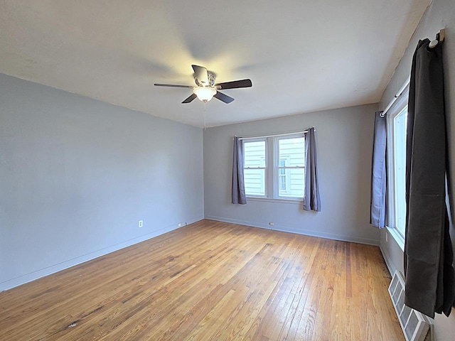 unfurnished room featuring ceiling fan and light wood-type flooring