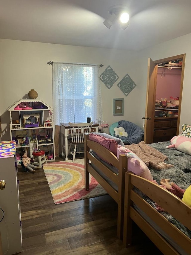 bedroom with dark hardwood / wood-style floors