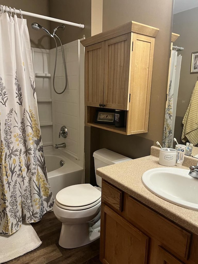 full bathroom with vanity, wood-type flooring, shower / bath combination with curtain, and toilet