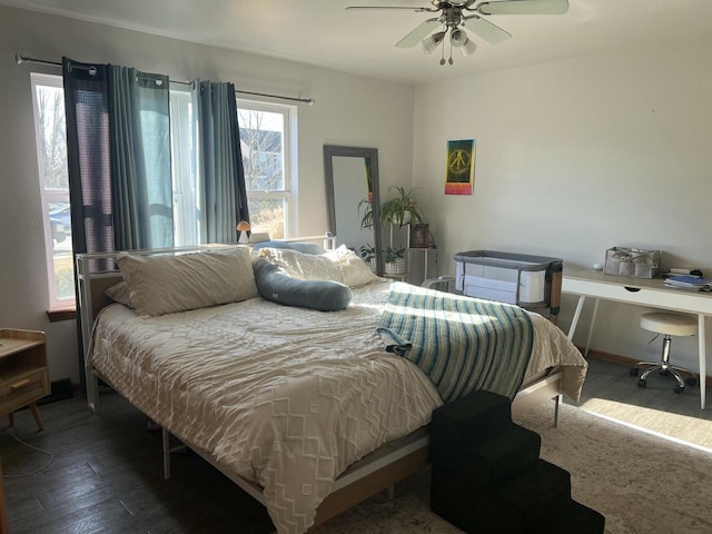 bedroom featuring dark wood-type flooring and ceiling fan