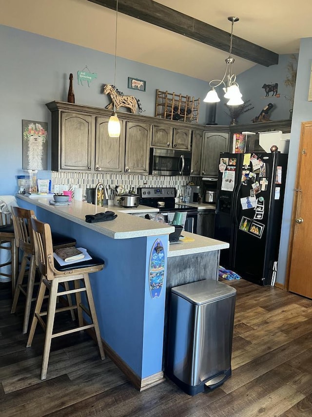 kitchen featuring electric range oven, pendant lighting, kitchen peninsula, dark brown cabinets, and black refrigerator with ice dispenser