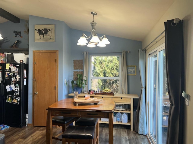 dining space featuring lofted ceiling with beams, dark wood-type flooring, and an inviting chandelier