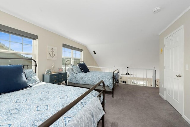 bedroom featuring vaulted ceiling and carpet