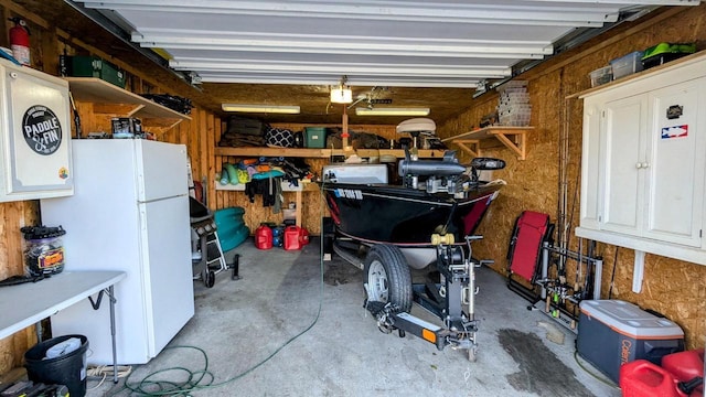 garage with white refrigerator