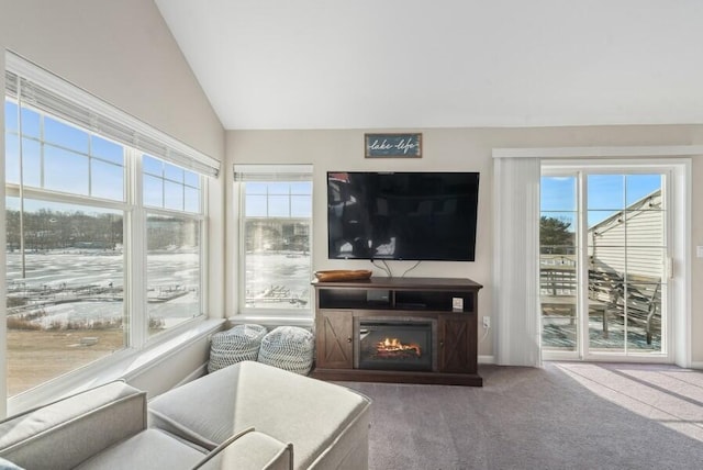 living room with vaulted ceiling and carpet