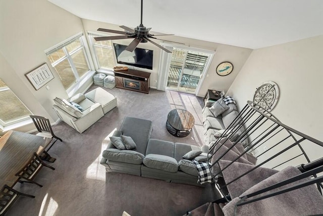 carpeted living room featuring lofted ceiling and ceiling fan