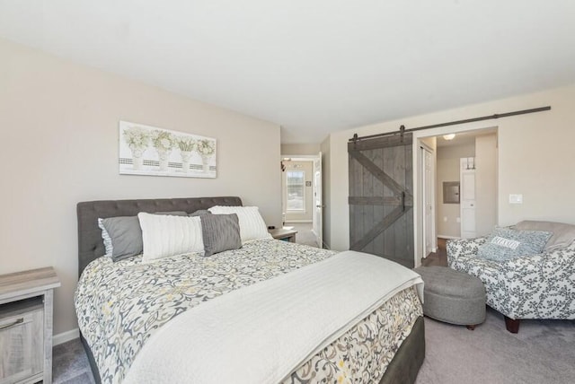 bedroom featuring carpet flooring and a barn door