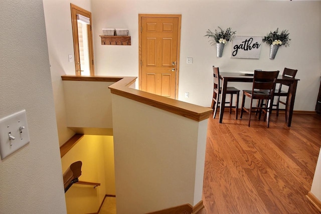 corridor featuring wood-type flooring