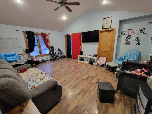 living room featuring wood-type flooring, vaulted ceiling, and ceiling fan