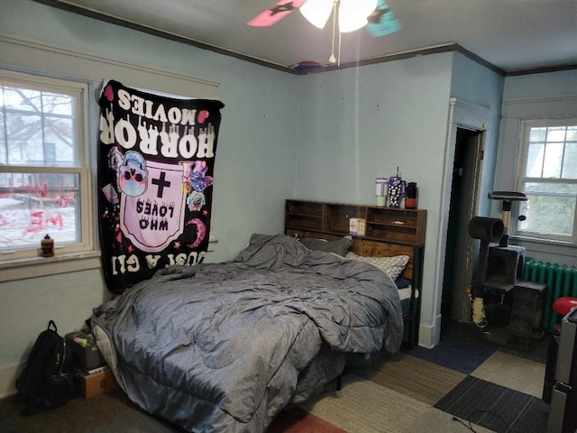 bedroom with ceiling fan and ornamental molding