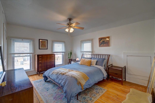 bedroom featuring ceiling fan and light hardwood / wood-style floors