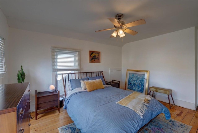 bedroom with light hardwood / wood-style floors and ceiling fan