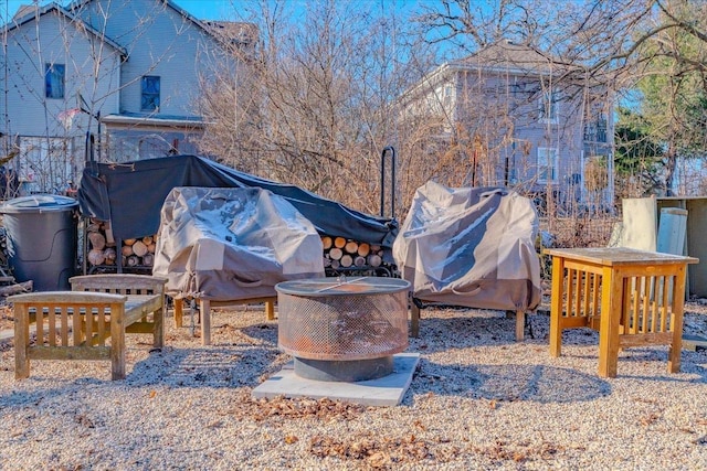 view of yard with a fire pit