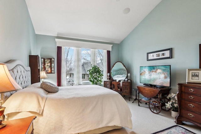 carpeted bedroom with vaulted ceiling