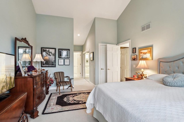 carpeted bedroom featuring ensuite bath