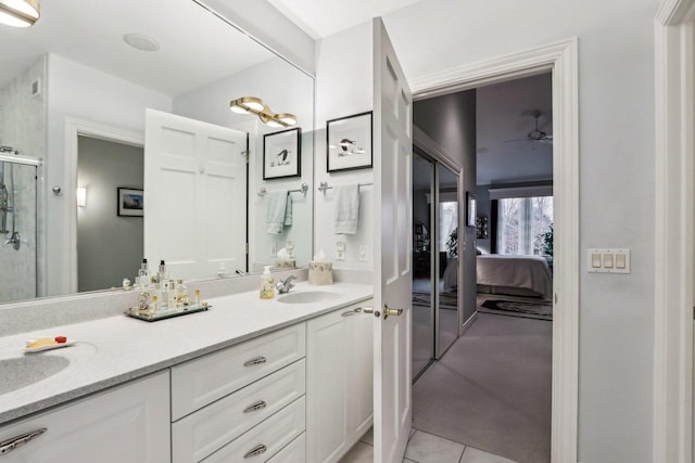 bathroom featuring ceiling fan, vanity, and tile patterned floors