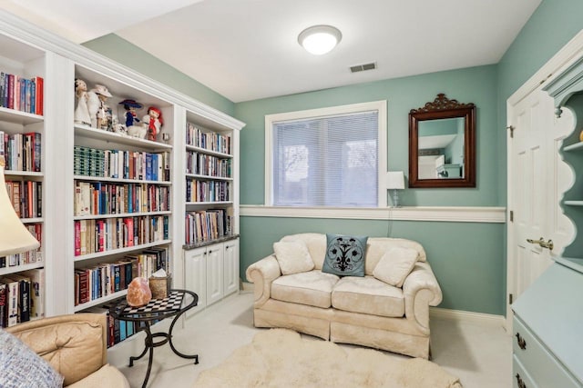 sitting room with light colored carpet