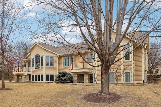 rear view of house with a yard